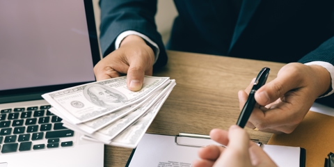 Signing a contract to get a payday loan