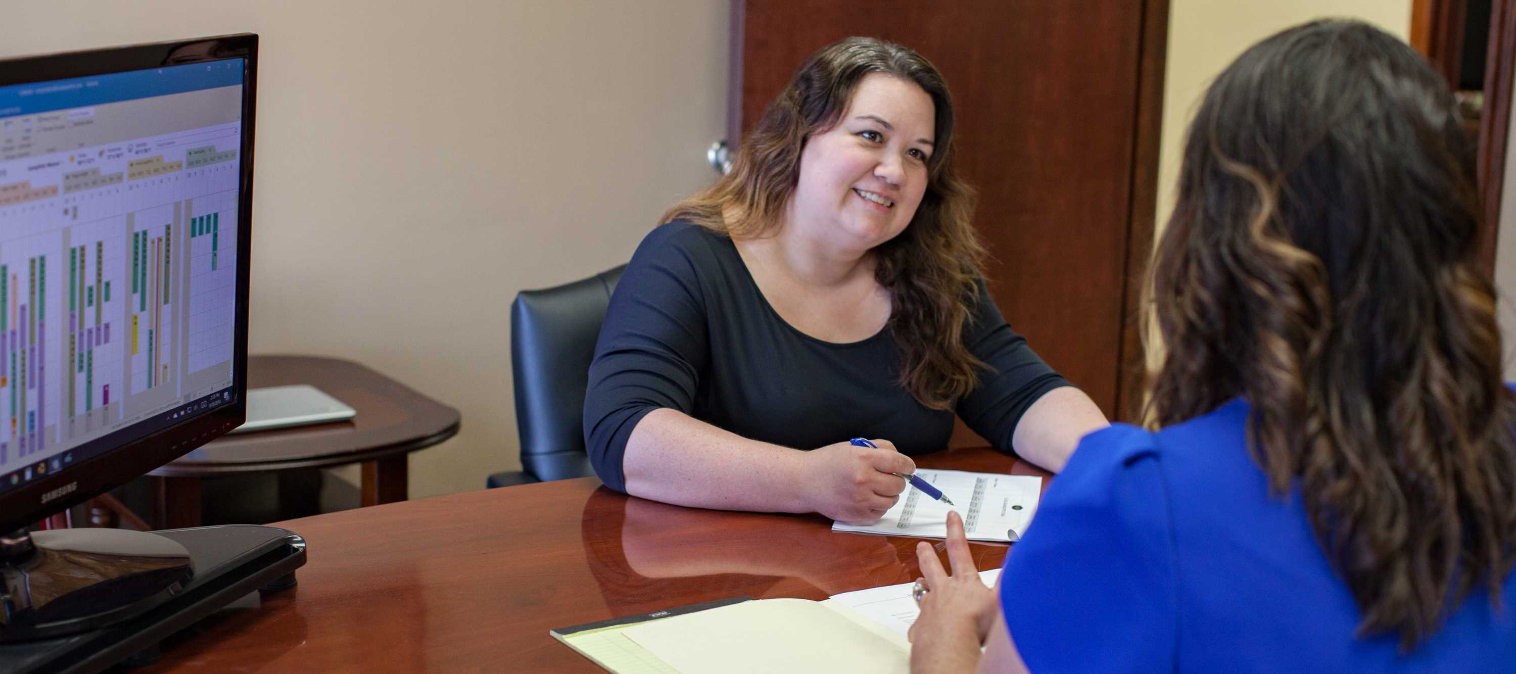 Happy woman talking to agent