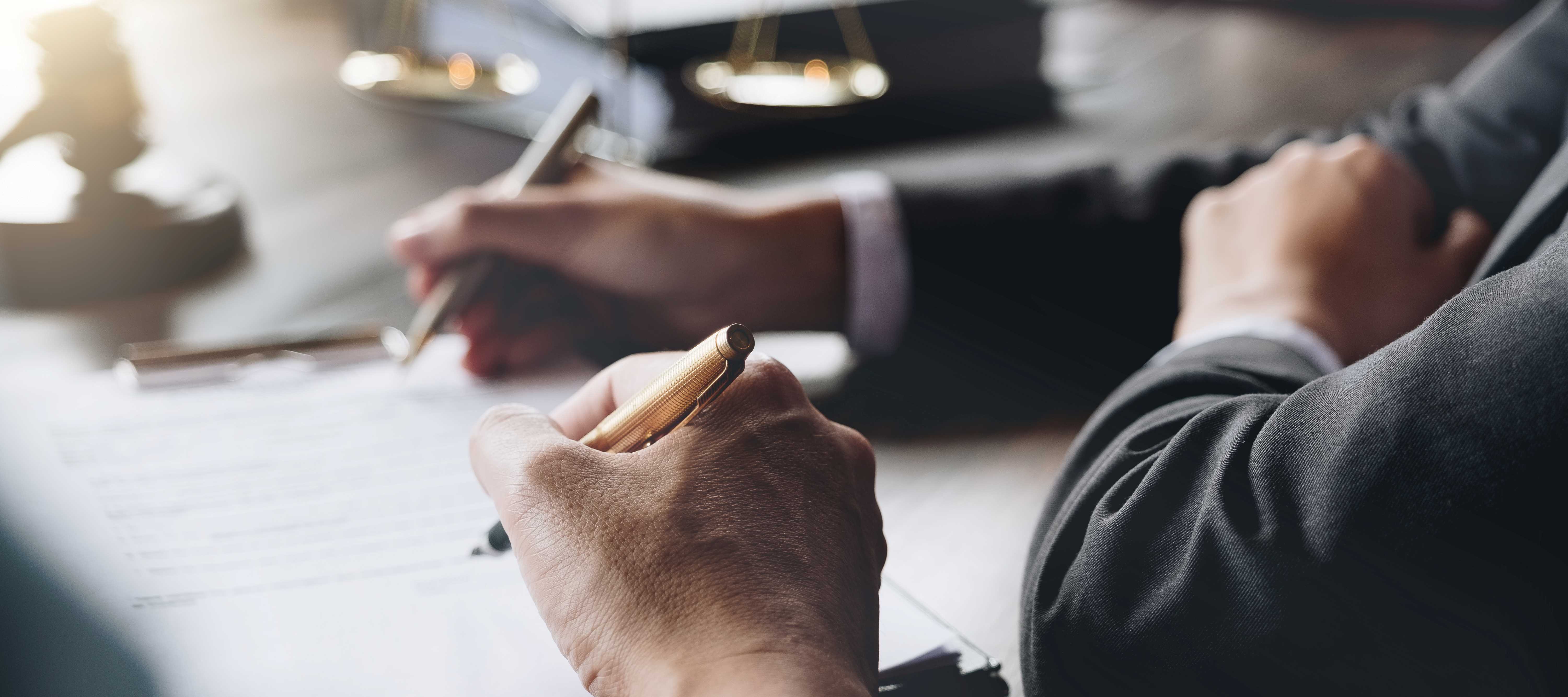 people writing down on a paper