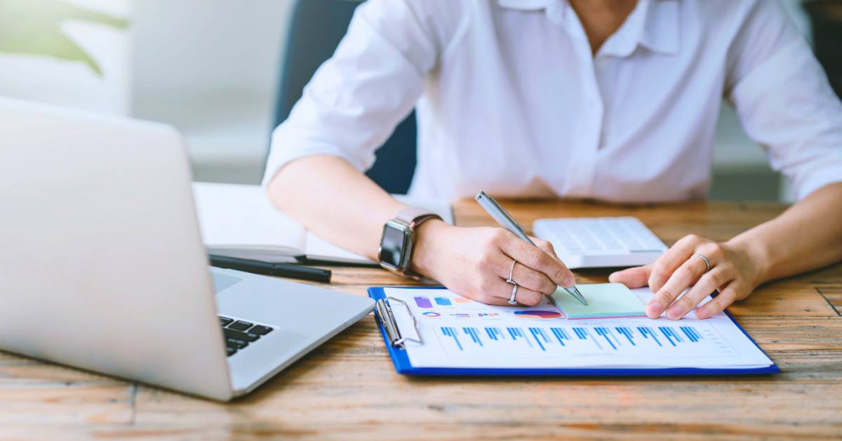 Person analyzing chart and graph showing changes on salary