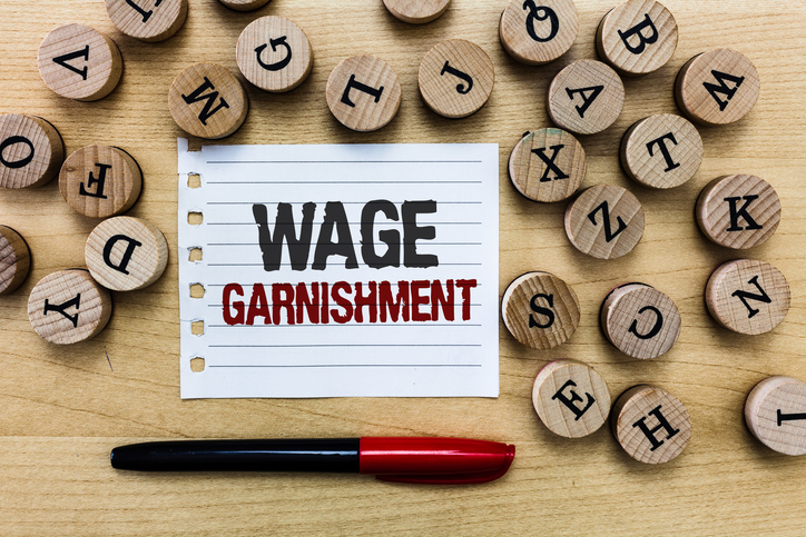 Word writing text Wage Garnishment. Business concept for Deducting money from compensation